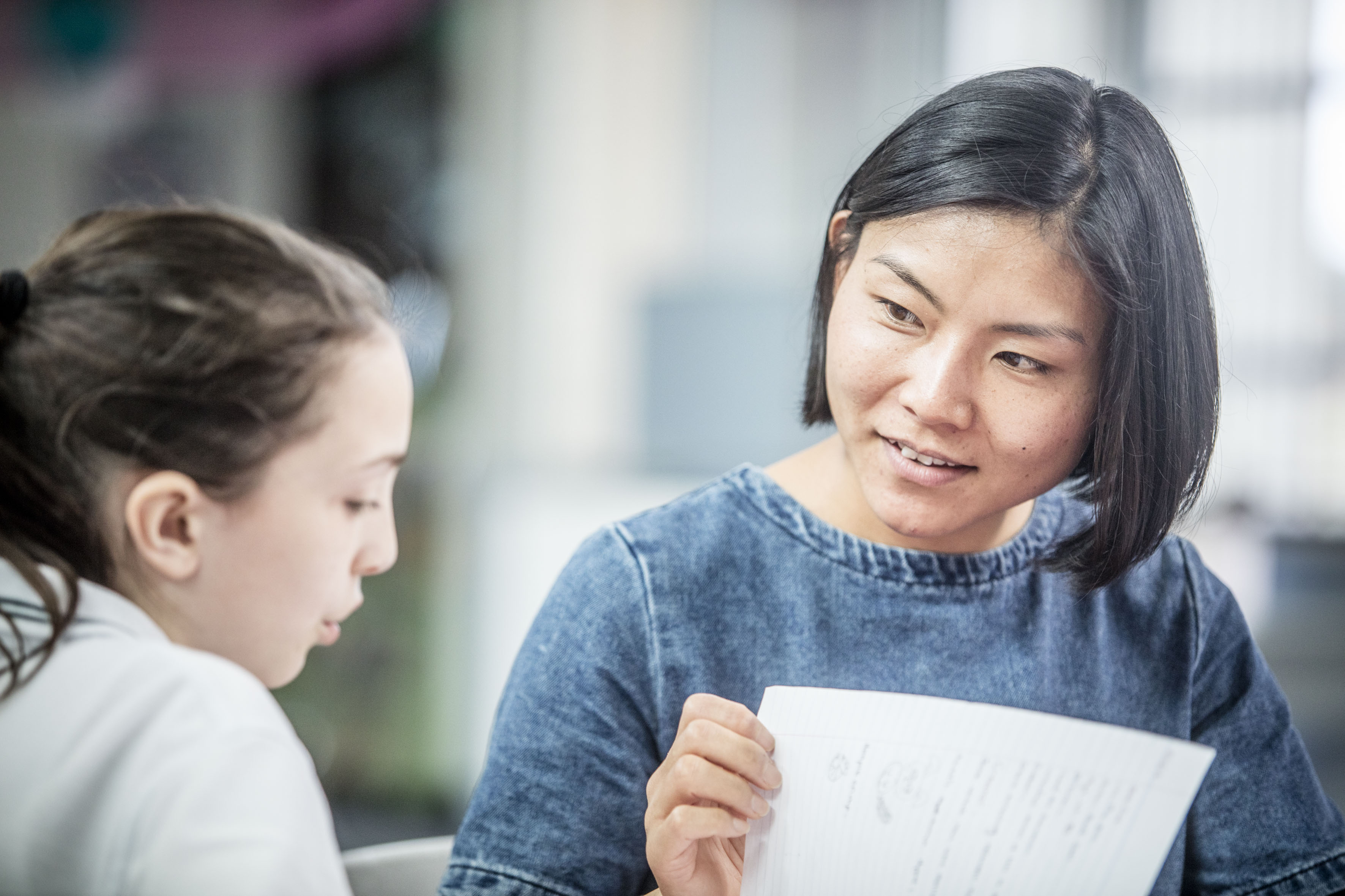 teacher and student in classroom