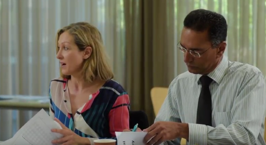 School leaders sitting at table